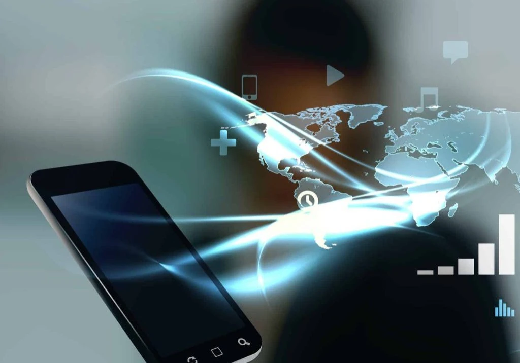 Mobile phone with blurred man on background