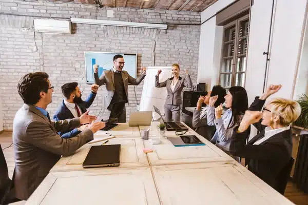 IT team celebrating with client